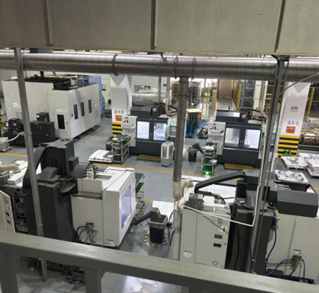 Machining workshop with enclosed CNC equipment