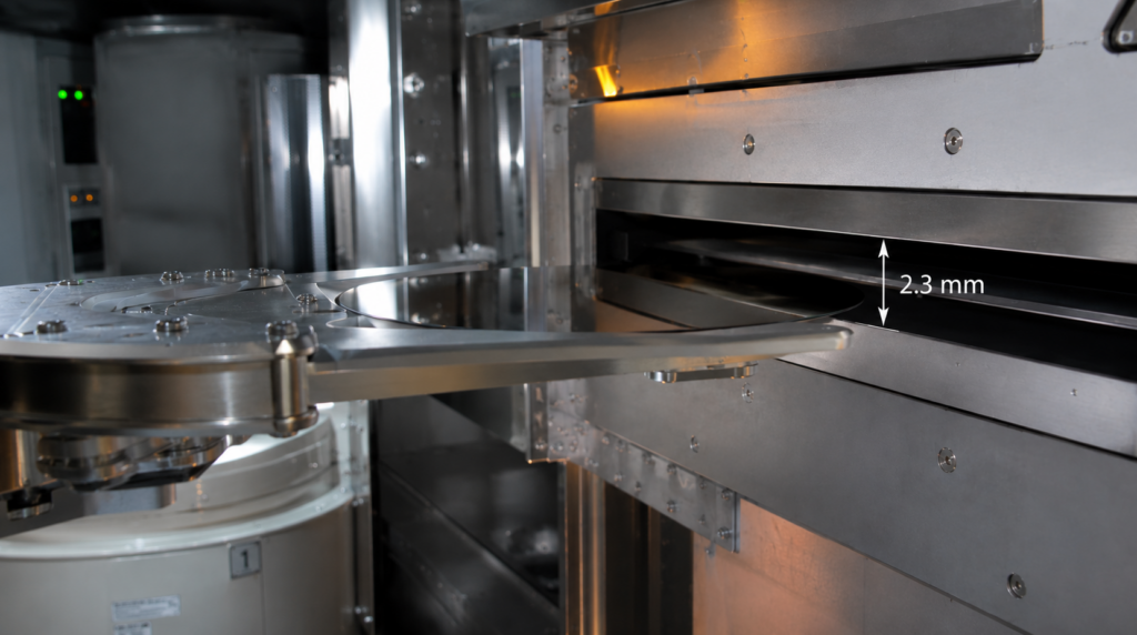 Please insert a high-definition picture of the “Endura 5500 Buffer Chamber Robot Delivering a Wafer to the PVD Chamber” here, highlighting the clearance between the wafer and the Slit Valve